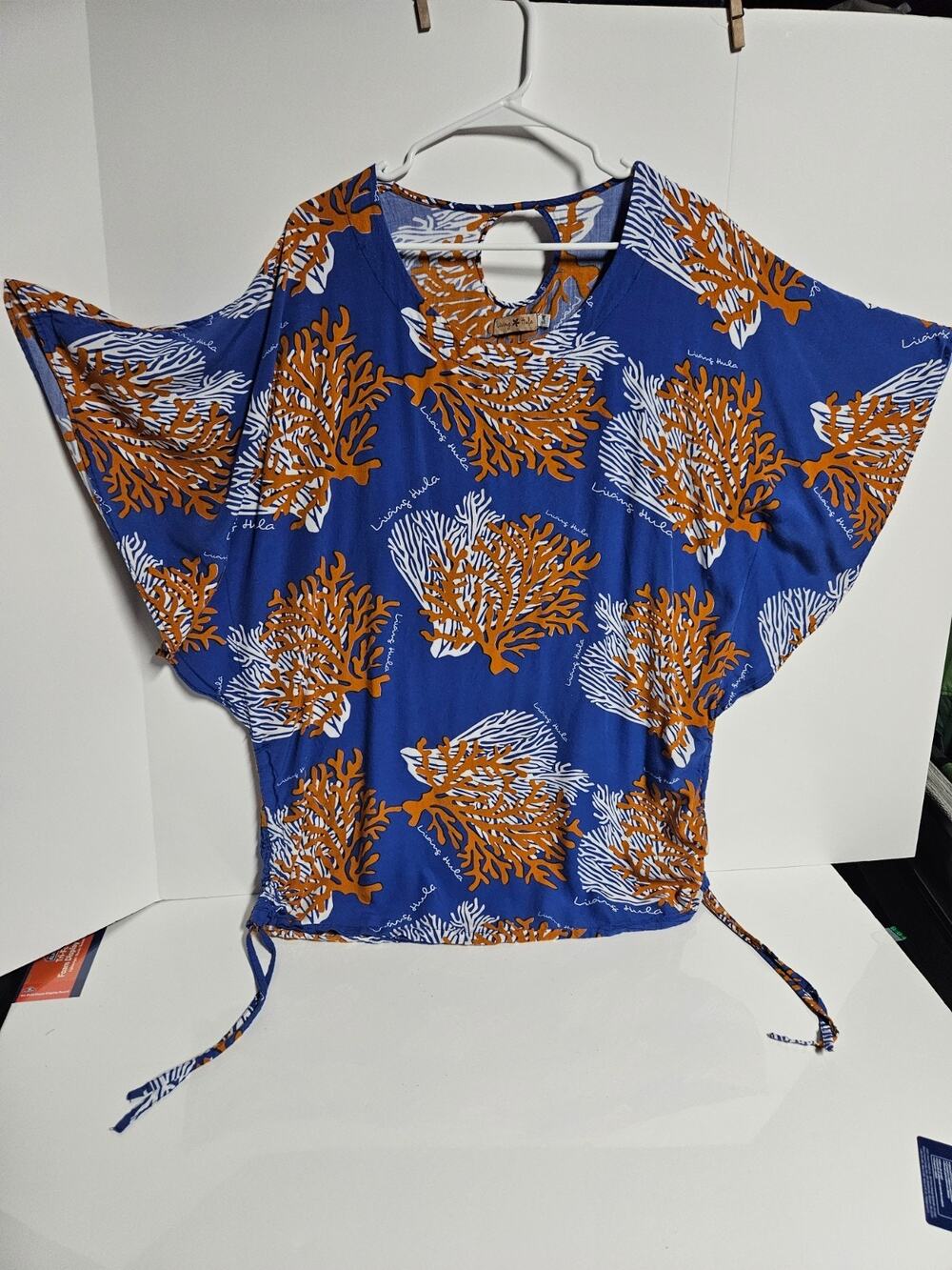 Living Hula top with a loose, flowy cut and side ties